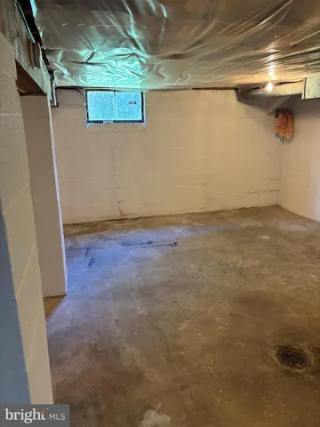 a view of a room with wooden walls