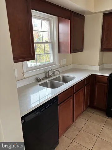 a kitchen with a sink and a window