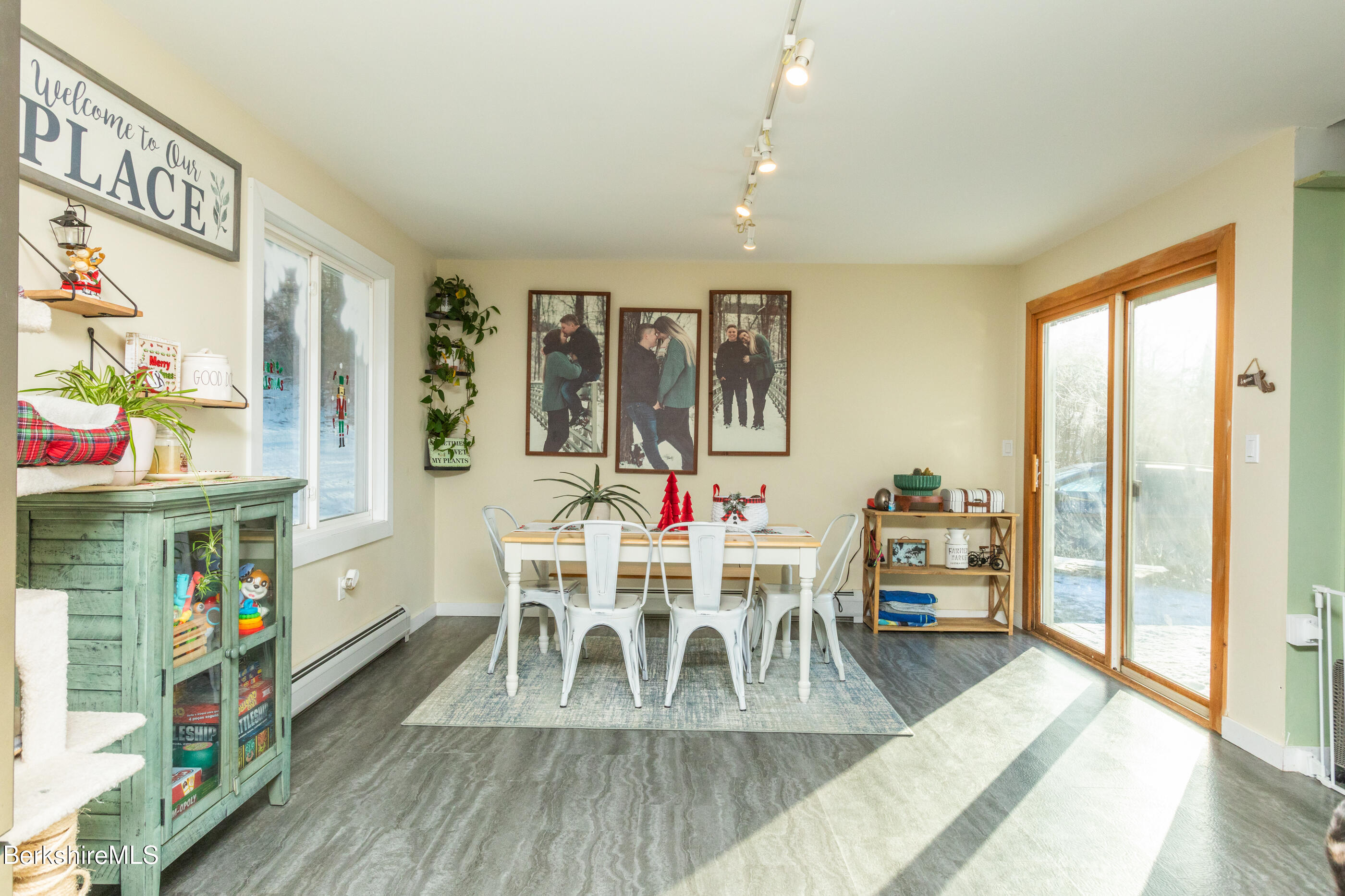 162 North Hoosac Road Williamstown, MA 01267 - Photo 8 of 37 a view of a dining room with furniture a chandelier and wooden floor