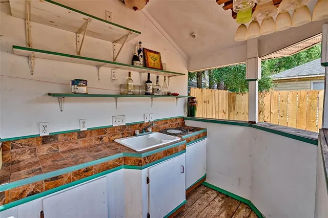 a storage room with wooden floor and windows