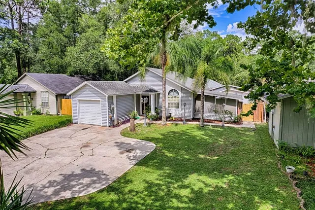 a front view of a house with a garden and porch