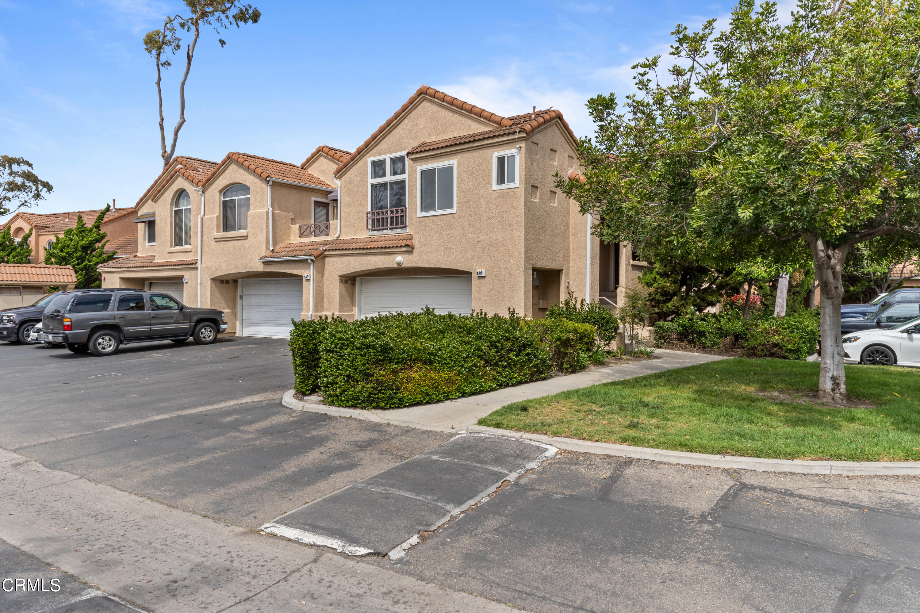 a view of multiple houses with a yard