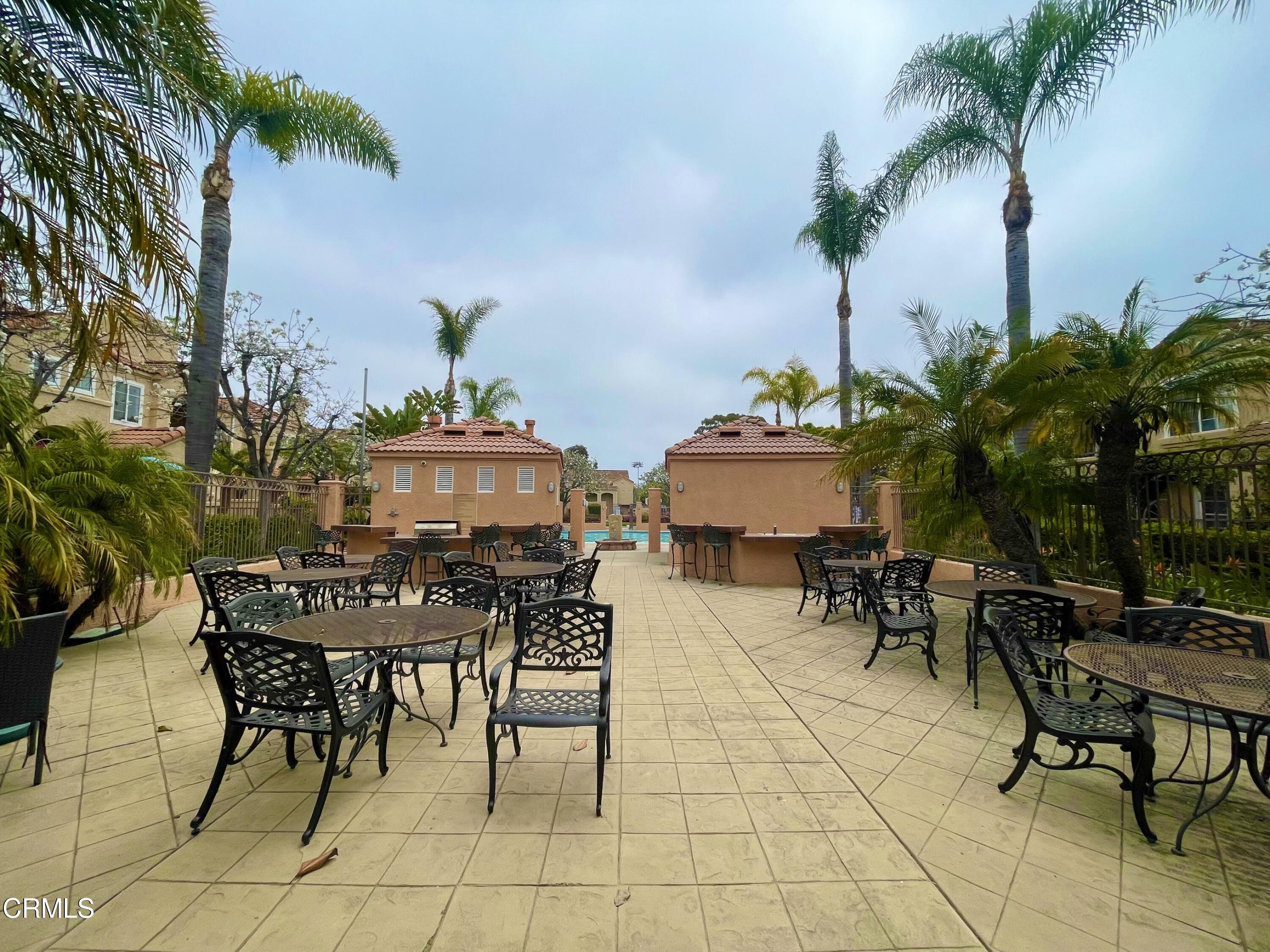 738 Moby Dick Lane Oxnard, CA 93030 - Photo 12 of 48 a view of a dinning table and chairs in patio