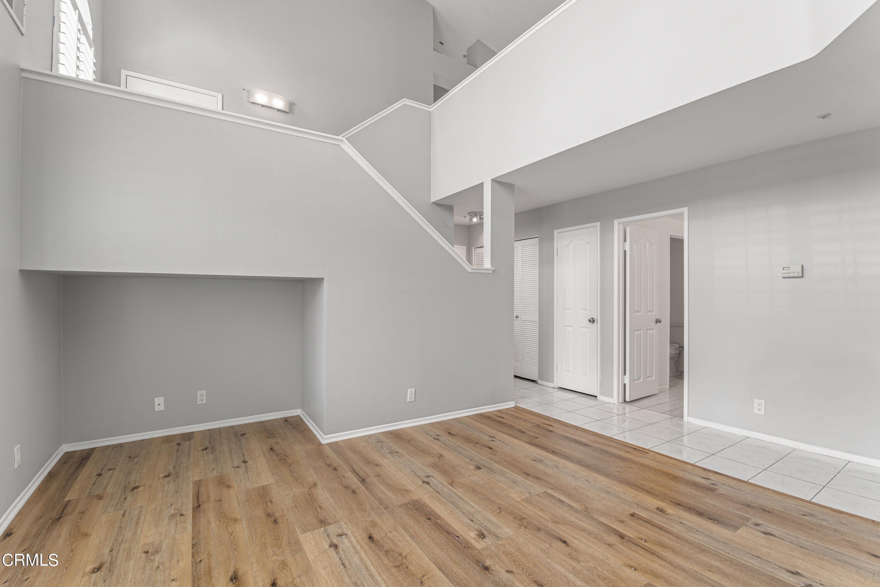 738 Moby Dick Lane Oxnard, CA 93030 - Photo 14 of 48 wooden floor in an empty room with a workspace