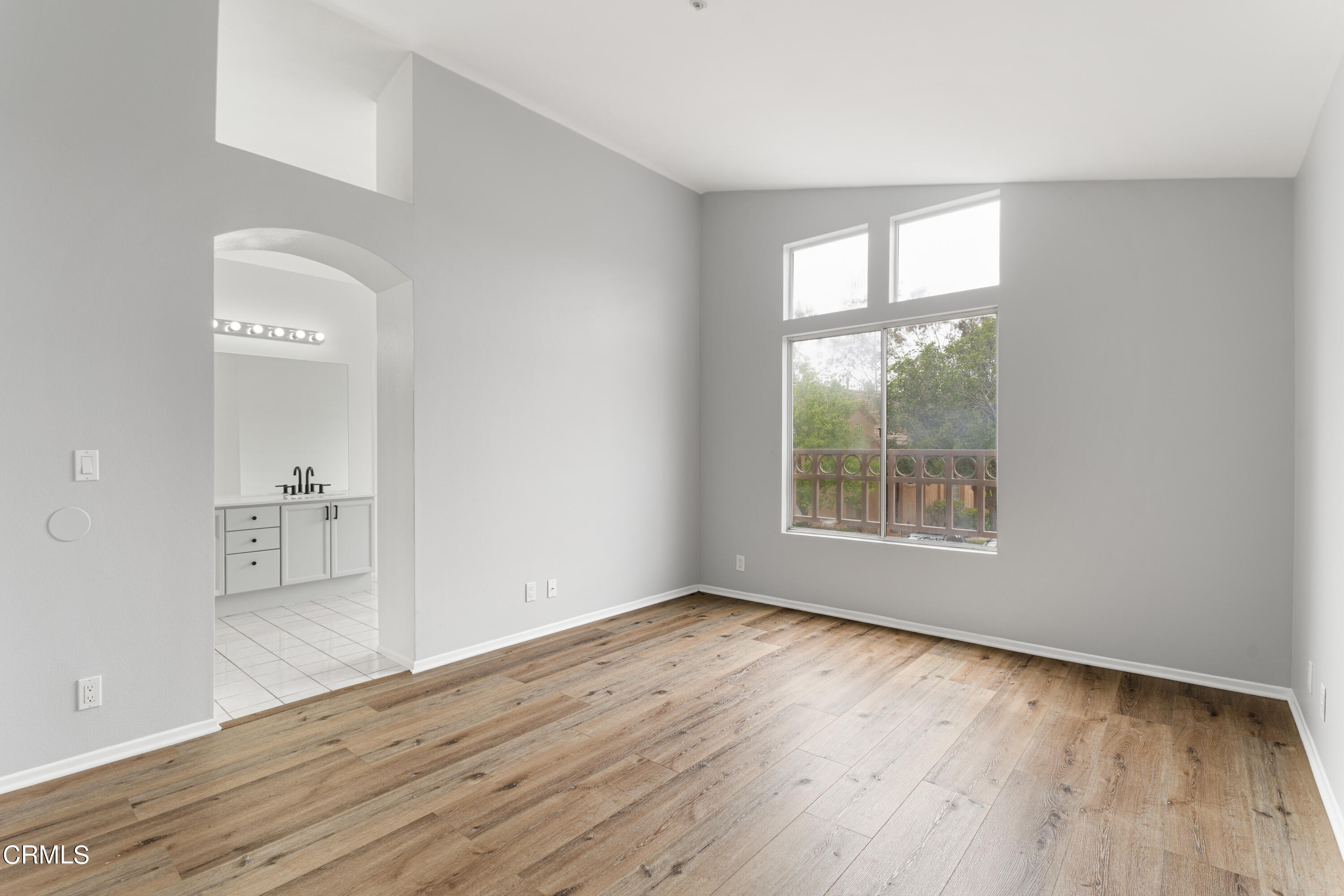 738 Moby Dick Lane Oxnard, CA 93030 - Photo 18 of 48 an empty room with wooden floor and windows