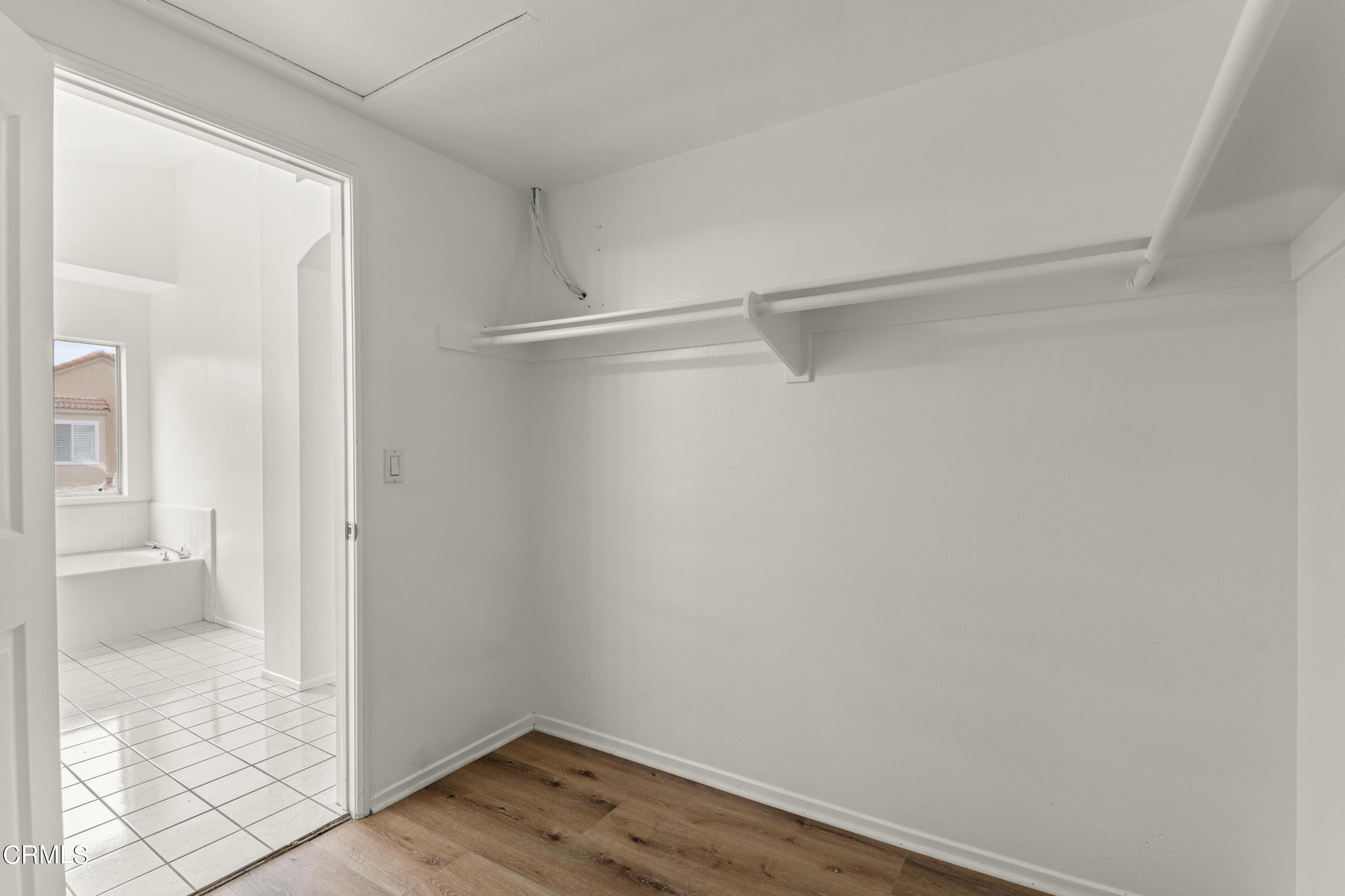738 Moby Dick Lane Oxnard, CA 93030 - Photo 20 of 48 a view of an empty walk in closet with wooden floor