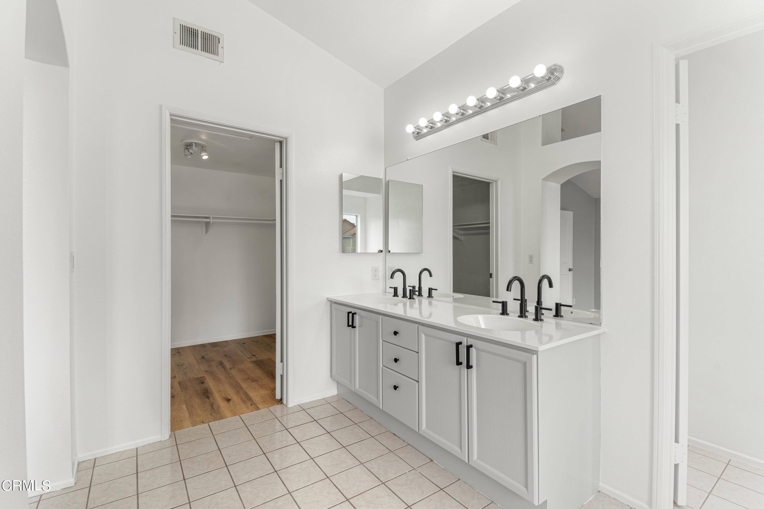 738 Moby Dick Lane Oxnard, CA 93030 - Photo 22 of 48 a spacious bathroom with a double vanity sink mirror and