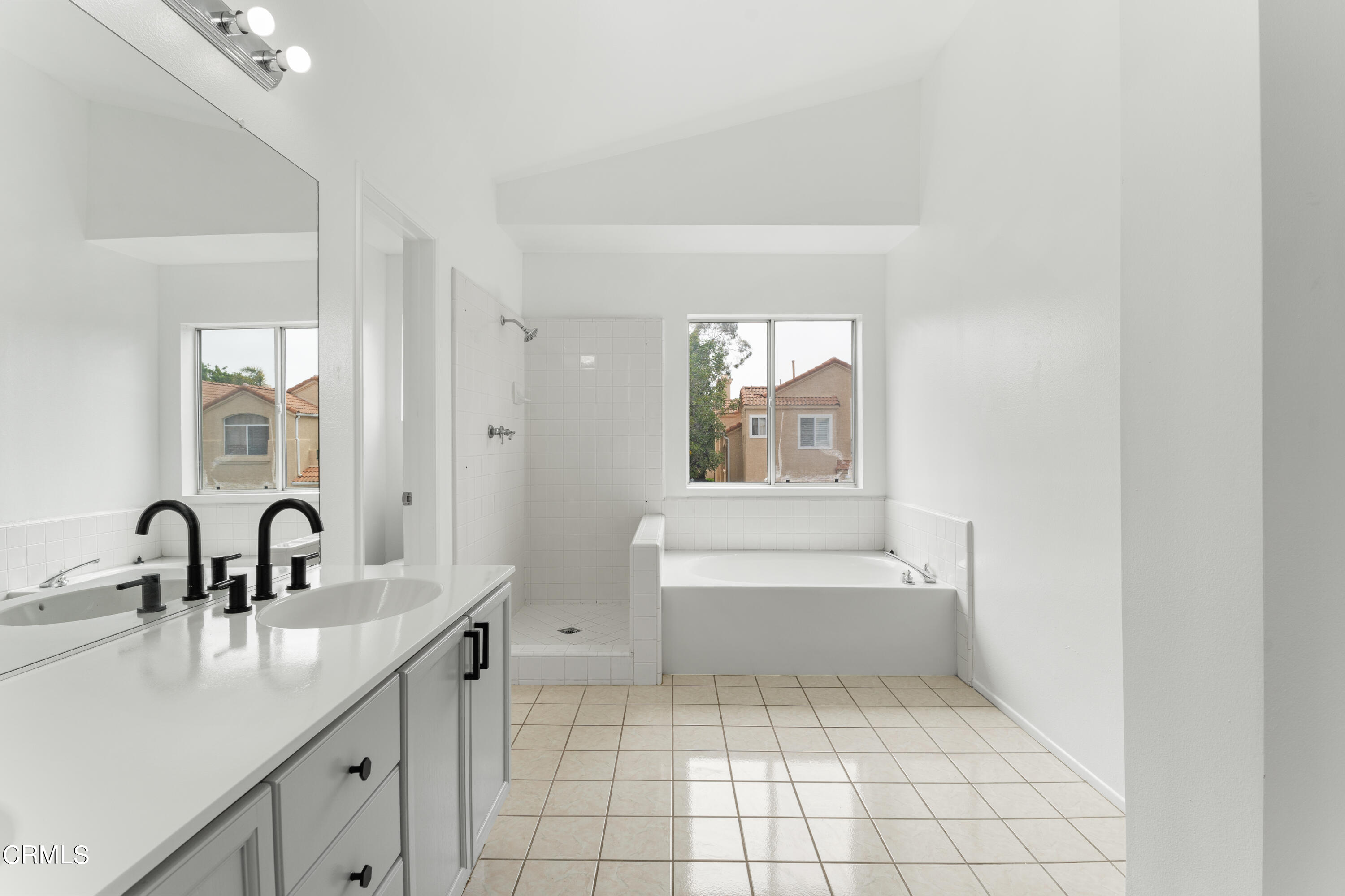 738 Moby Dick Lane Oxnard, CA 93030 - Photo 24 of 48 a bathroom with a sink a bathtub and mirror