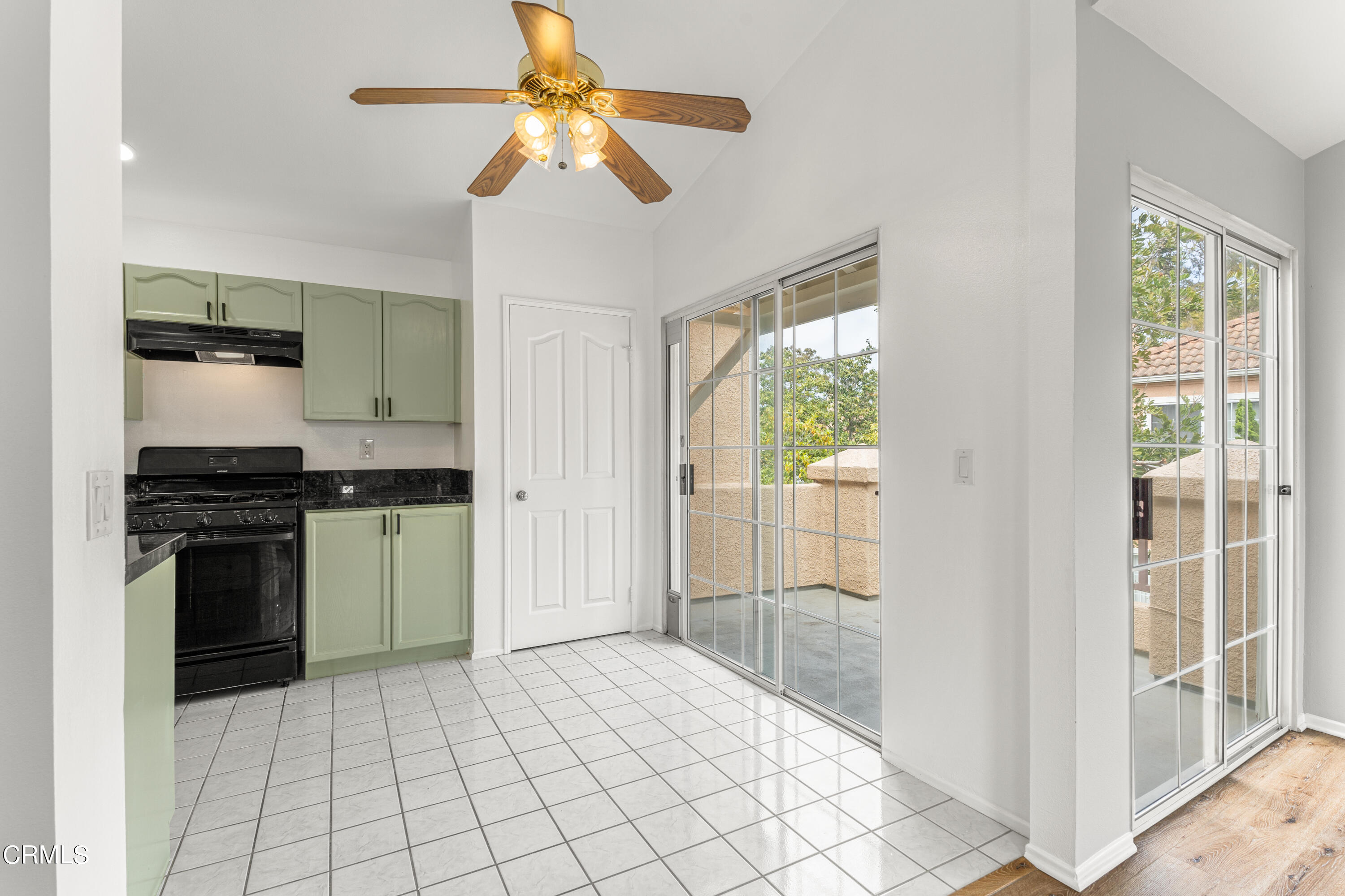 738 Moby Dick Lane Oxnard, CA 93030 - Photo 31 of 48 a kitchen with a refrigerator and a stove top oven