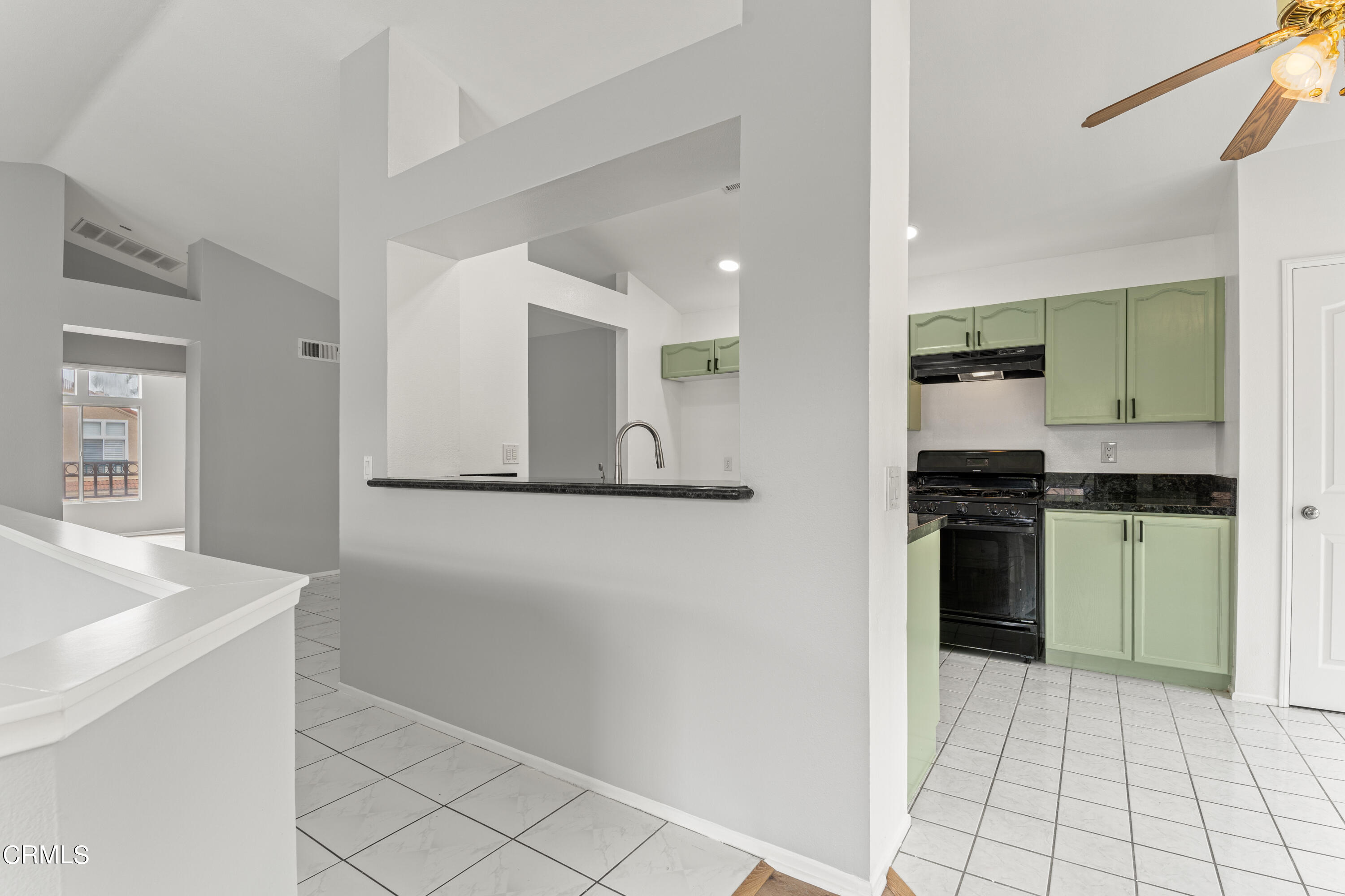 738 Moby Dick Lane Oxnard, CA 93030 - Photo 32 of 48 a kitchen with a refrigerator and a sink