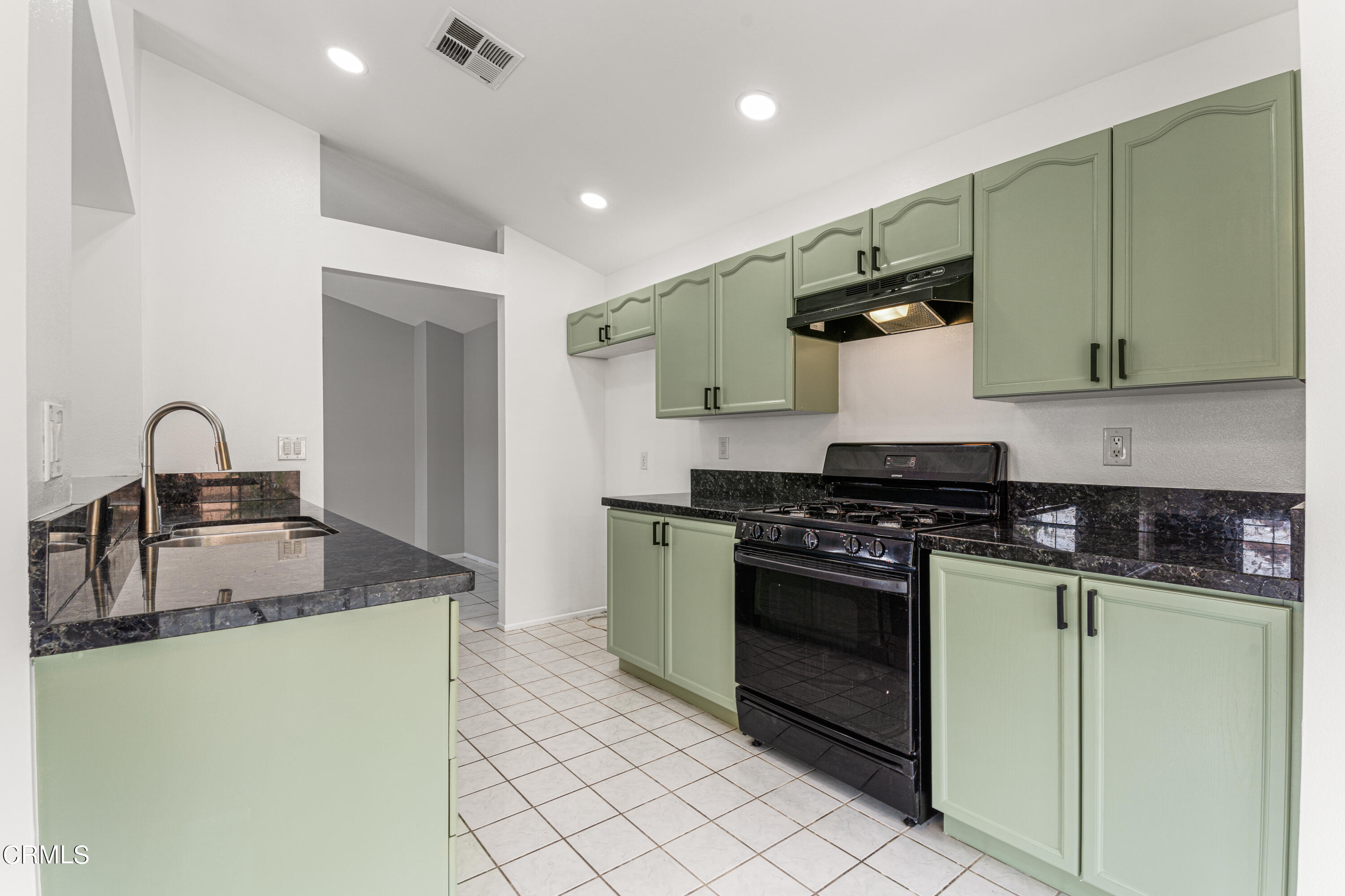 738 Moby Dick Lane Oxnard, CA 93030 - Photo 33 of 48 a kitchen with stainless steel appliances granite countertop a sink and a stove top oven