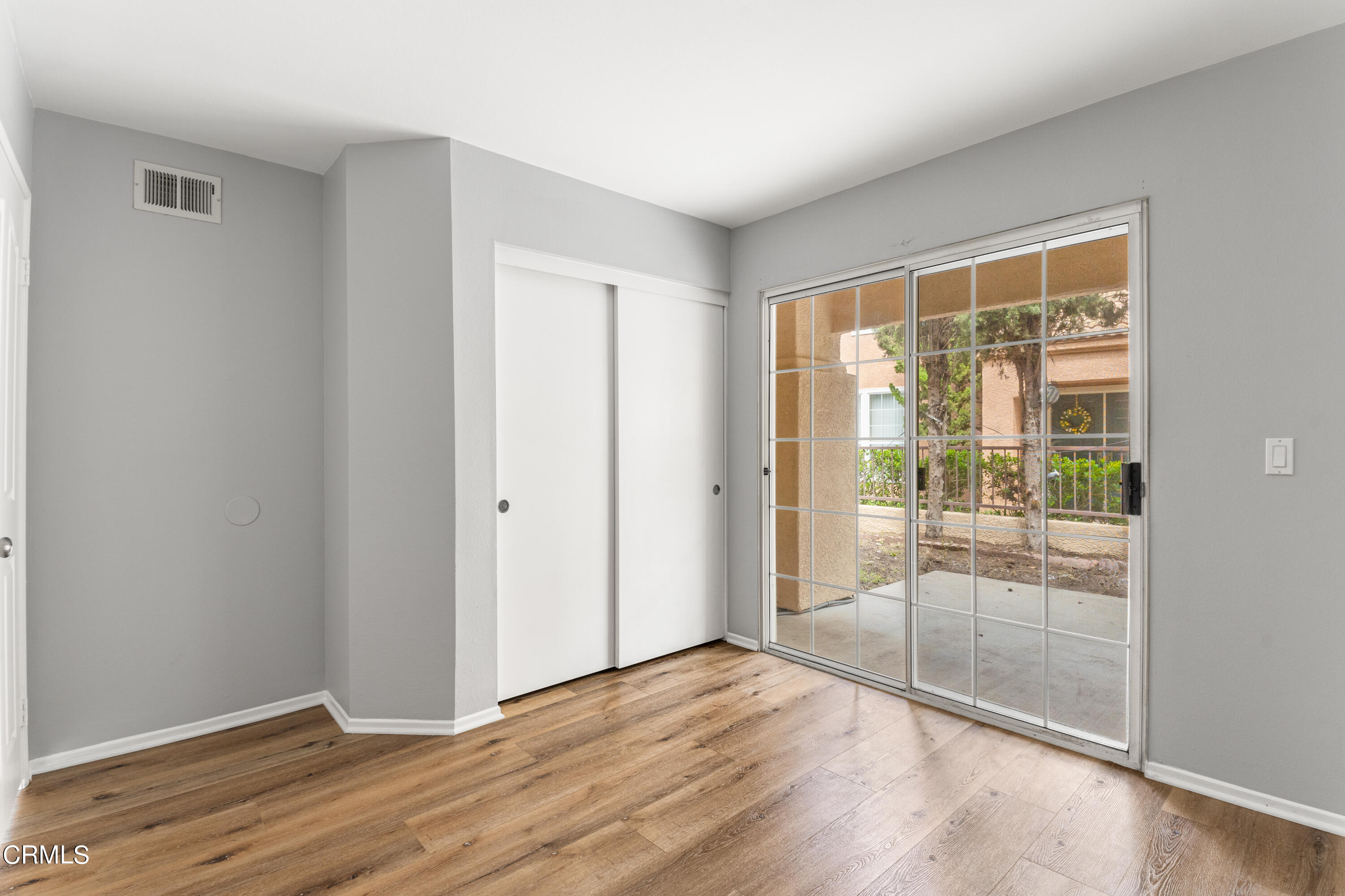 738 Moby Dick Lane Oxnard, CA 93030 - Photo 42 of 48 a view of an empty room with wooden floor and a window