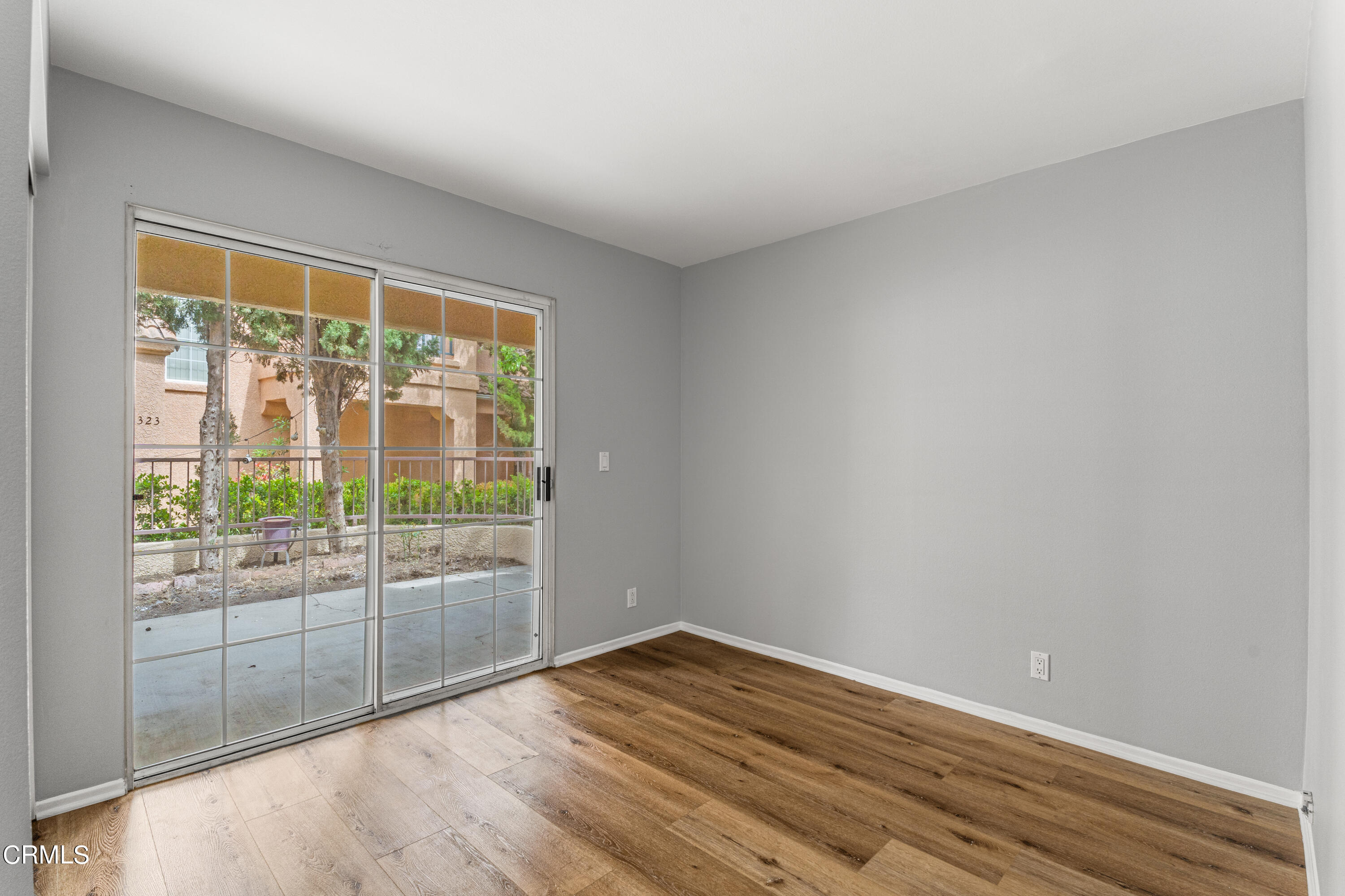738 Moby Dick Lane Oxnard, CA 93030 - Photo 43 of 48 a view of an empty room with wooden floor and a window