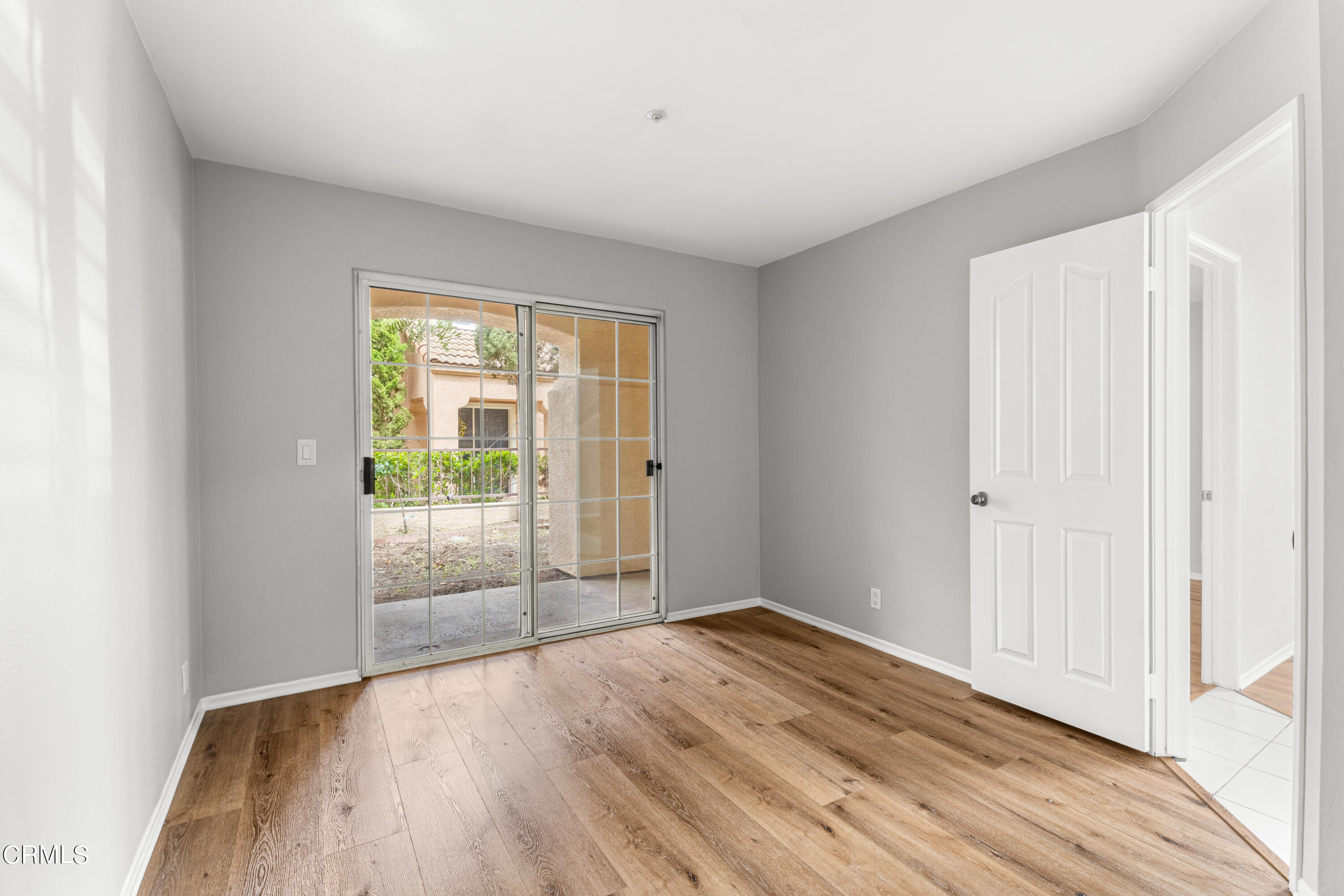 738 Moby Dick Lane Oxnard, CA 93030 - Photo 45 of 48 a view of an empty room with wooden floor and a window