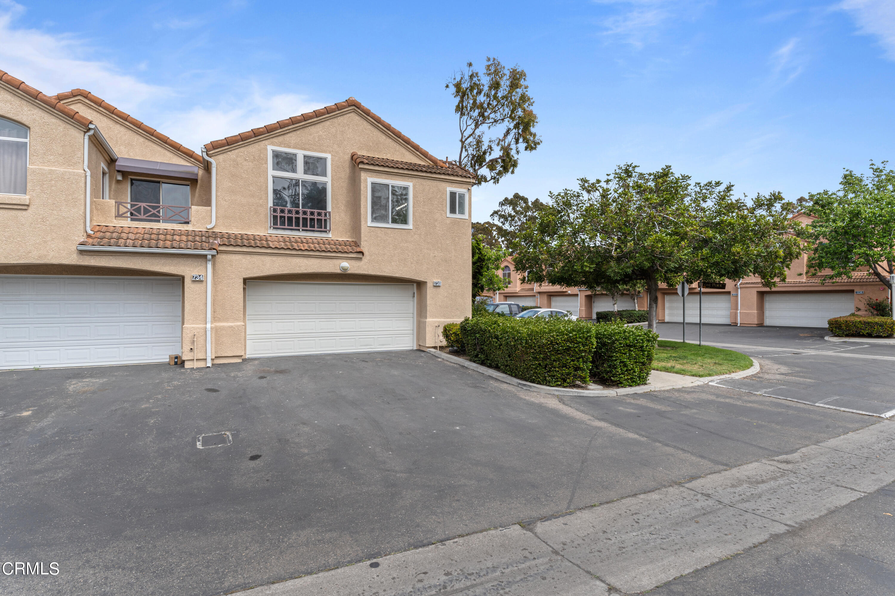 738 Moby Dick Lane Oxnard, CA 93030 - Photo 9 of 48 a front view of a house with a yard and garage