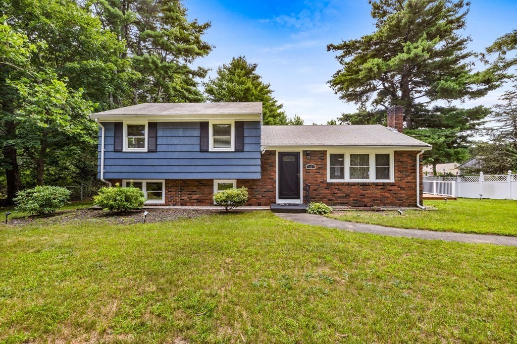 17 Pinetree Road Stoughton, MA 02072 - Photo 1 of 34 a front view of a house with a garden