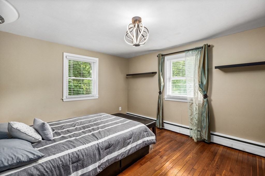 17 Pinetree Road Stoughton, MA 02072 - Photo 15 of 34 a bedroom with a bed and a window
