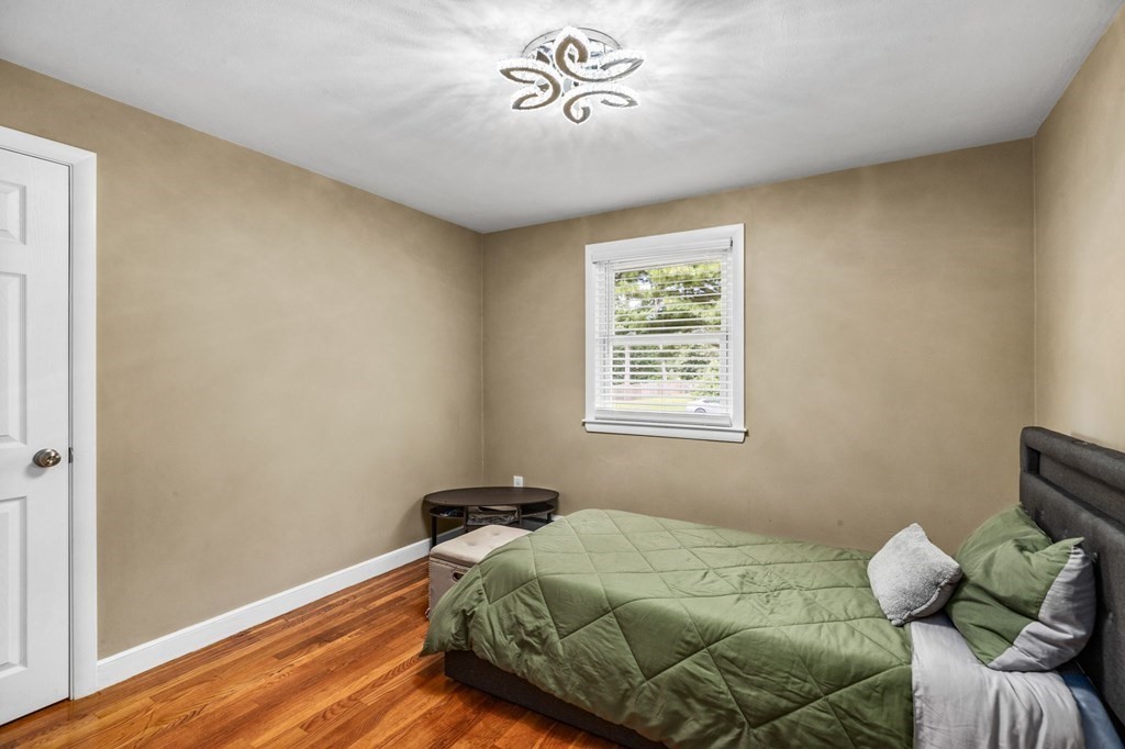 17 Pinetree Road Stoughton, MA 02072 - Photo 18 of 34 a bedroom with a bed and a window