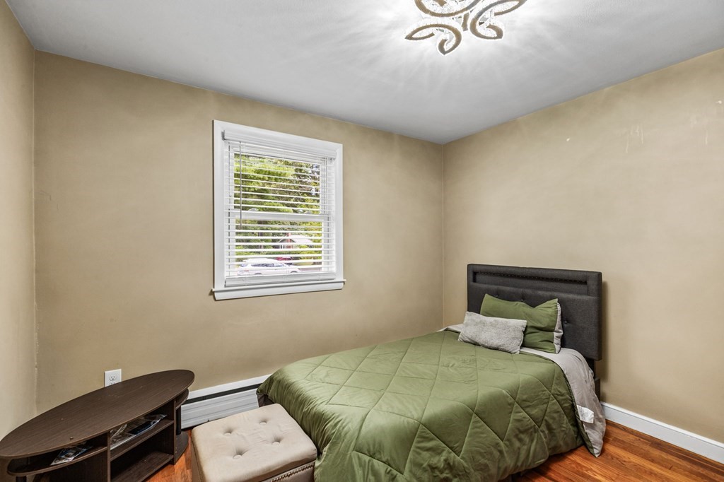 17 Pinetree Road Stoughton, MA 02072 - Photo 19 of 34 a bedroom with a bed and a window