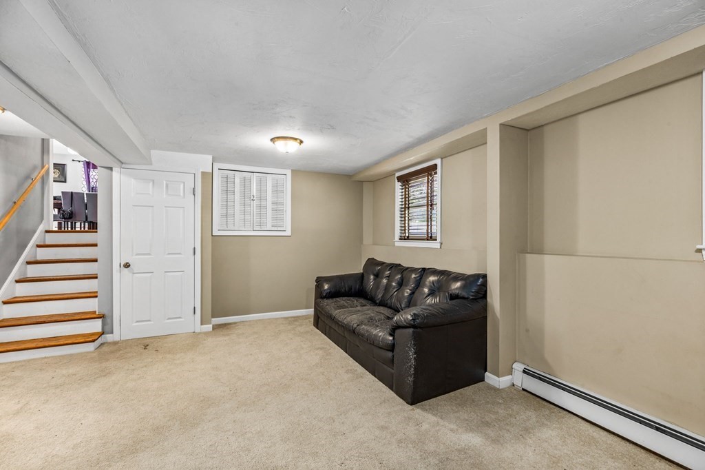 17 Pinetree Road Stoughton, MA 02072 - Photo 23 of 34 a living room with furniture and stairs