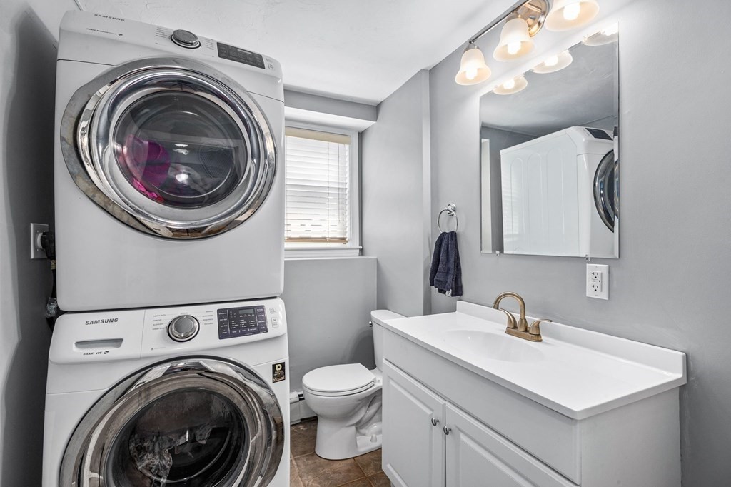 17 Pinetree Road Stoughton, MA 02072 - Photo 25 of 34 a bathroom with a sink mirror and toilet