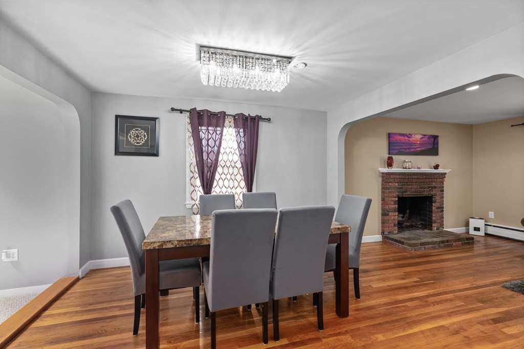 17 Pinetree Road Stoughton, MA 02072 - Photo 8 of 34 a view of a dining room with furniture wooden floor and a chandelier