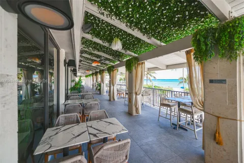 a view of a balcony with furniture