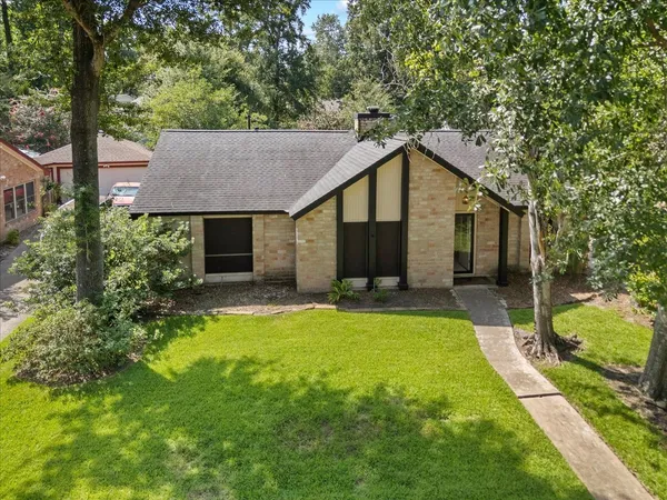 a front view of a house with a yard and porch