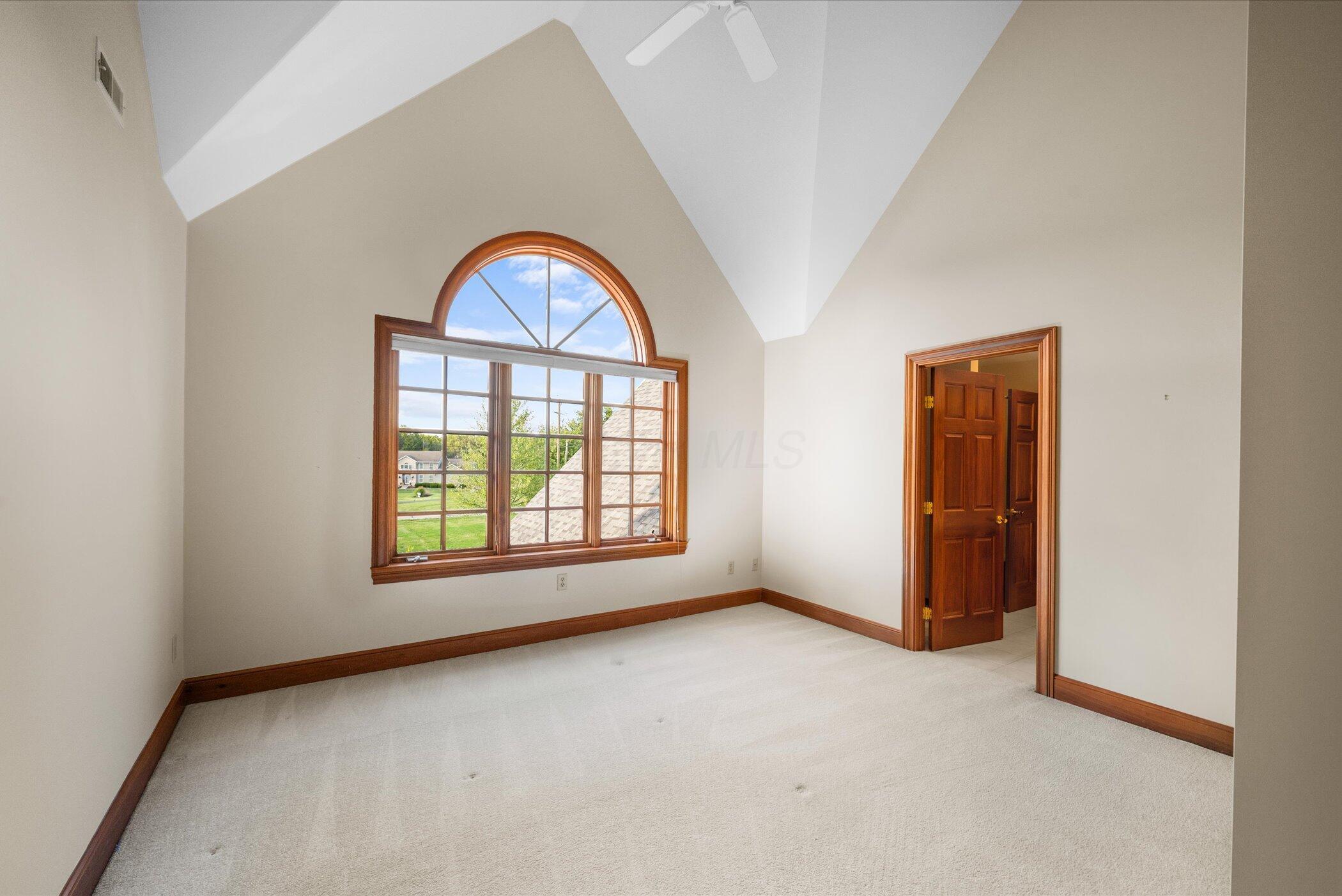 18261 Boerger Road Marysville, OH 43040 - Photo 49 of 94 Vaulted bedroom (#2) with large palladium window and ceiling fan - door to bathroom