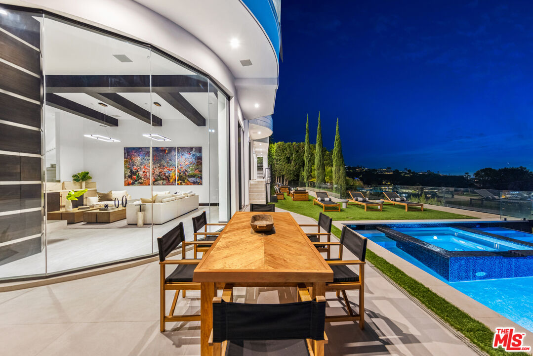 9374 Beverlycrest Drive Beverly Hills, CA 90210 - Photo 19 of 24 a view of a dining room with furniture and a kitchen