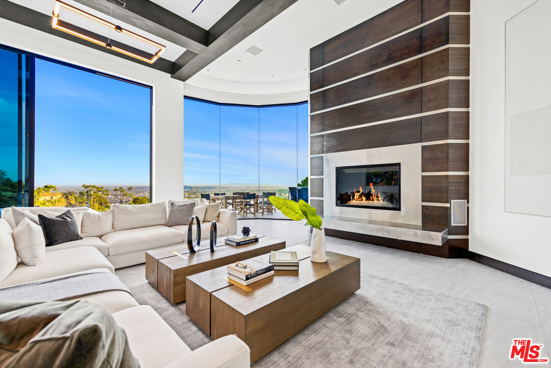 9374 Beverlycrest Drive Beverly Hills, CA 90210 - Photo 8 of 24 a living room with furniture and a fireplace