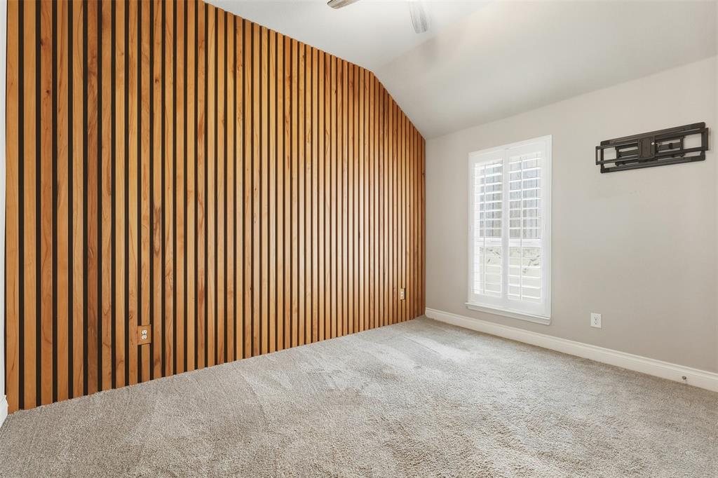 5640 Pradera Road Fort Worth, TX 76126 - Photo 21 of 35 Accent wall featuring wood slat detailing