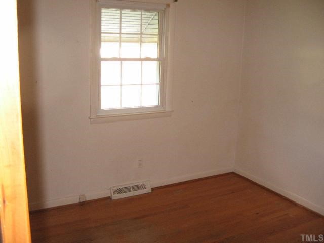 604 Peyton Street Raleigh, NC 27610 - Photo 5 of 6 Just one of the three bedrooms. All have hardwood flooring.
