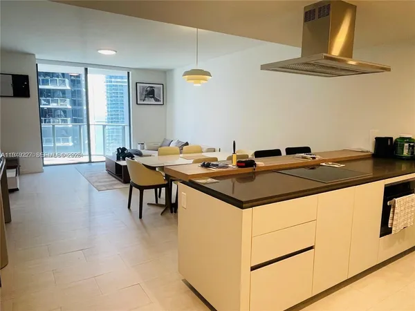 a kitchen with a table and chairs