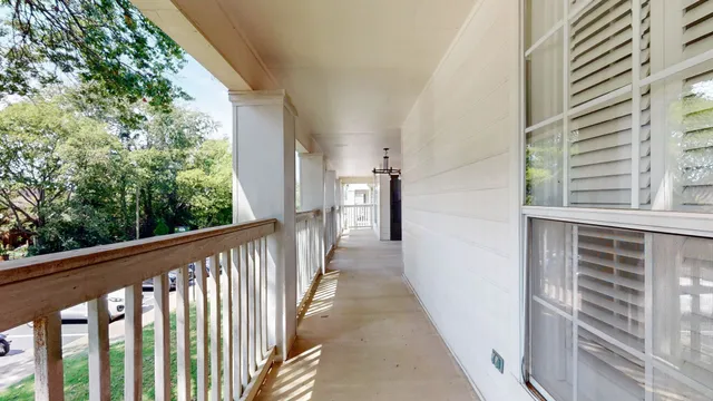 an aerial view of a house with a big yard
