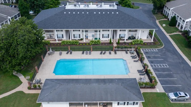 a front view of a building with a garden