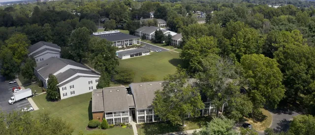 an aerial view of houses with yard