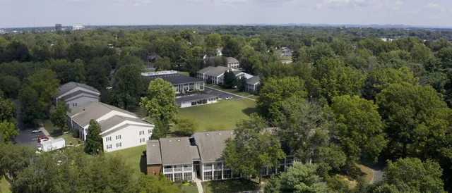 a view of a car parked in front of a house