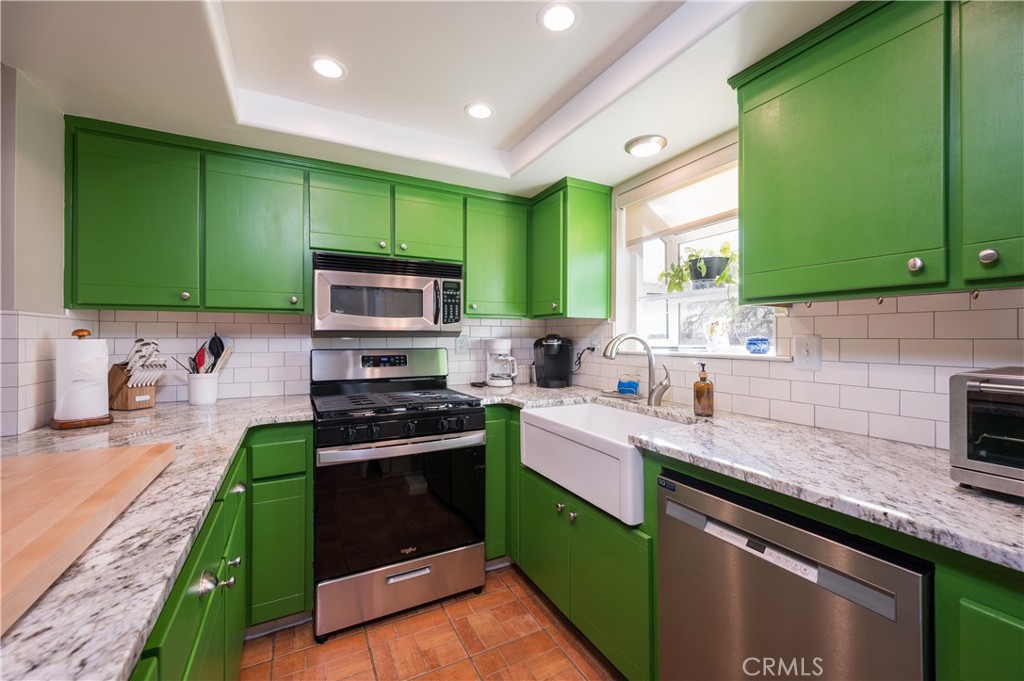 5175 White Tail Place Paso Robles, CA 93446 - Photo 12 of 37 a kitchen with sink a microwave and cabinets