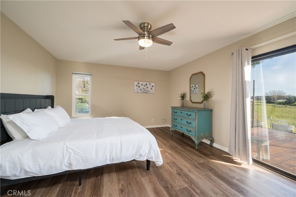5175 White Tail Place Paso Robles, CA 93446 - Photo 13 of 37 a bedroom with a bed and a chandelier