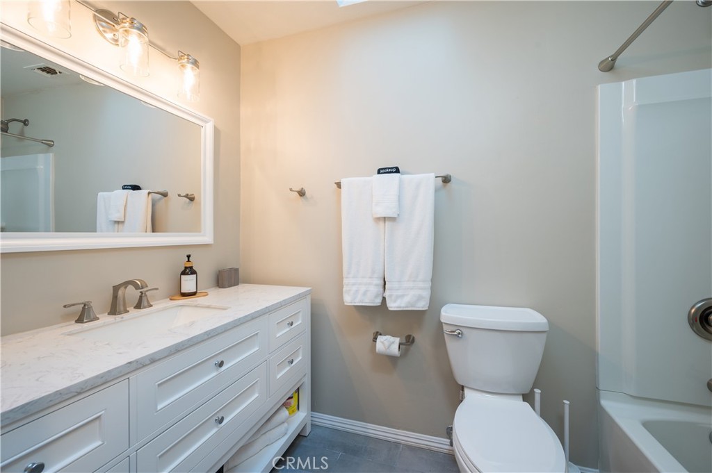 5175 White Tail Place Paso Robles, CA 93446 - Photo 17 of 37 a bathroom with a toilet sink and mirror