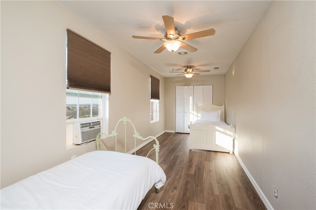 5175 White Tail Place Paso Robles, CA 93446 - Photo 19 of 37 a view of a livingroom with wooden floor and a ceiling fan