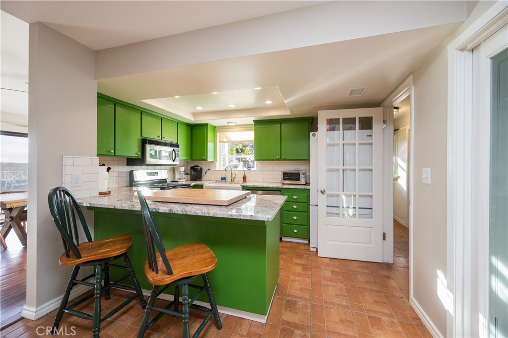 5175 White Tail Place Paso Robles, CA 93446 - Photo 10 of 37 a view of a kitchen and dining area with cabinets
