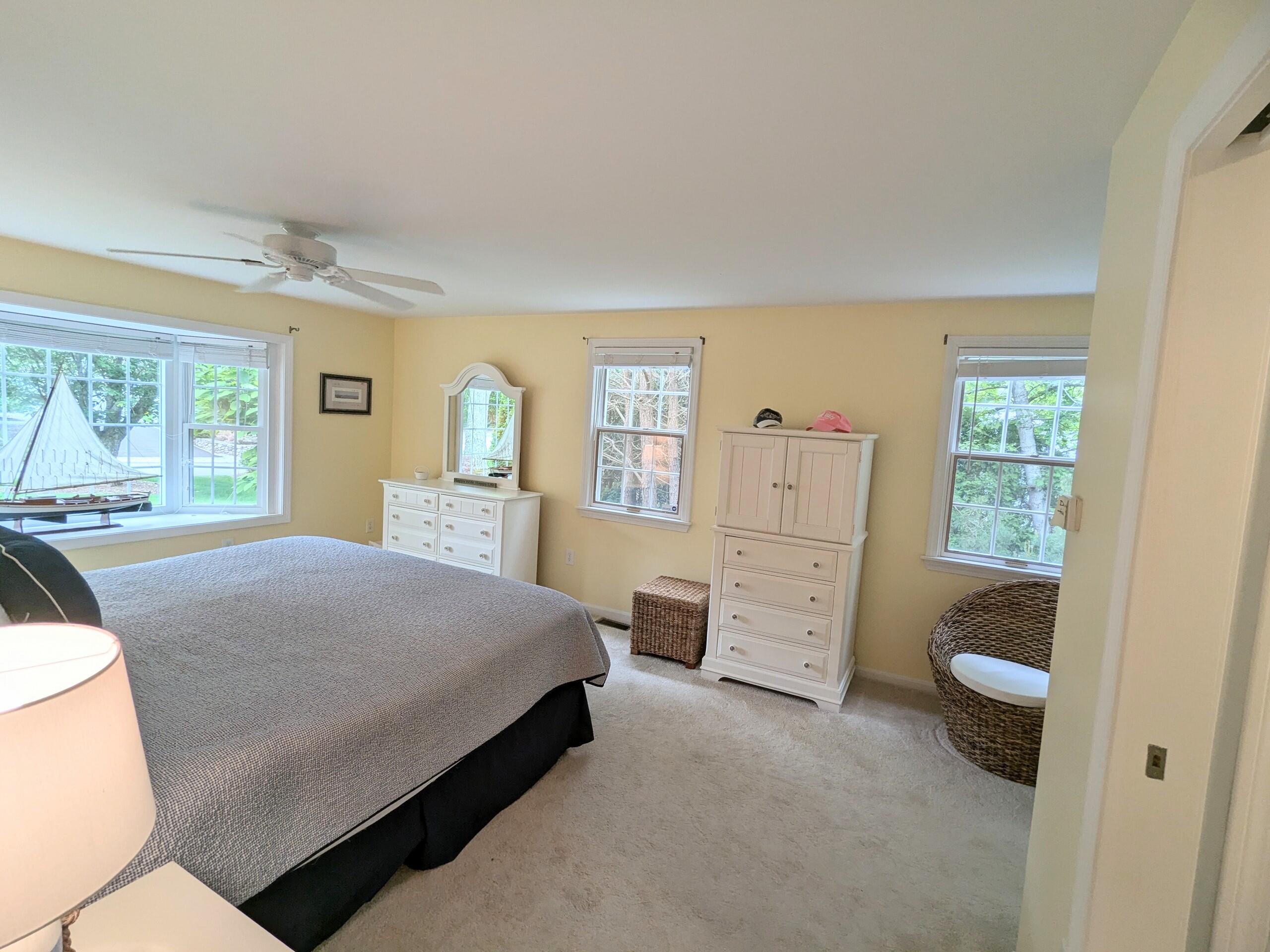 32 Apple Lane Dennis, MA 02638 - Photo 18 of 48 a bedroom with a bed and a dresser