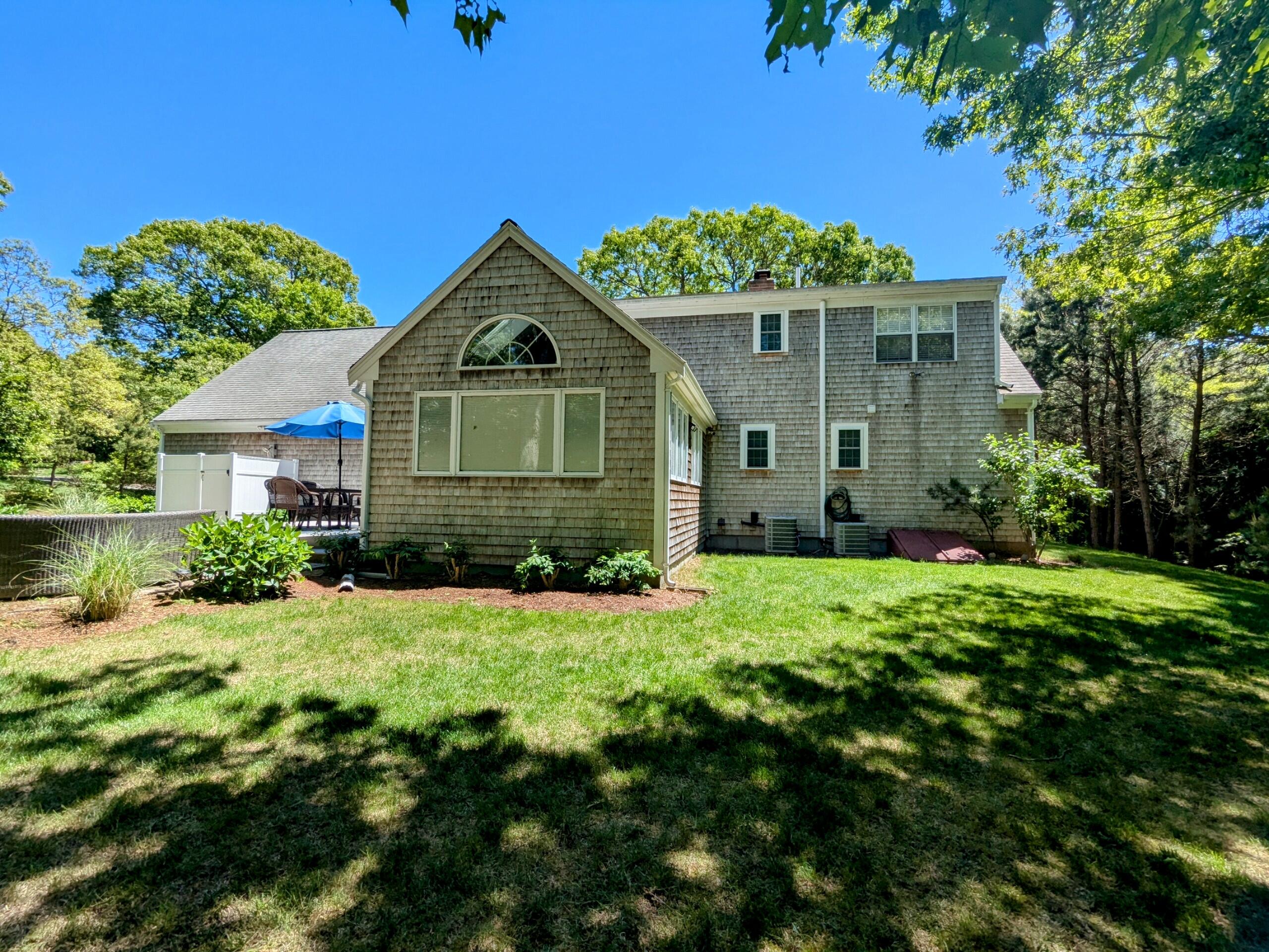 32 Apple Lane Dennis, MA 02638 - Photo 47 of 48 a front view of a house with a yard