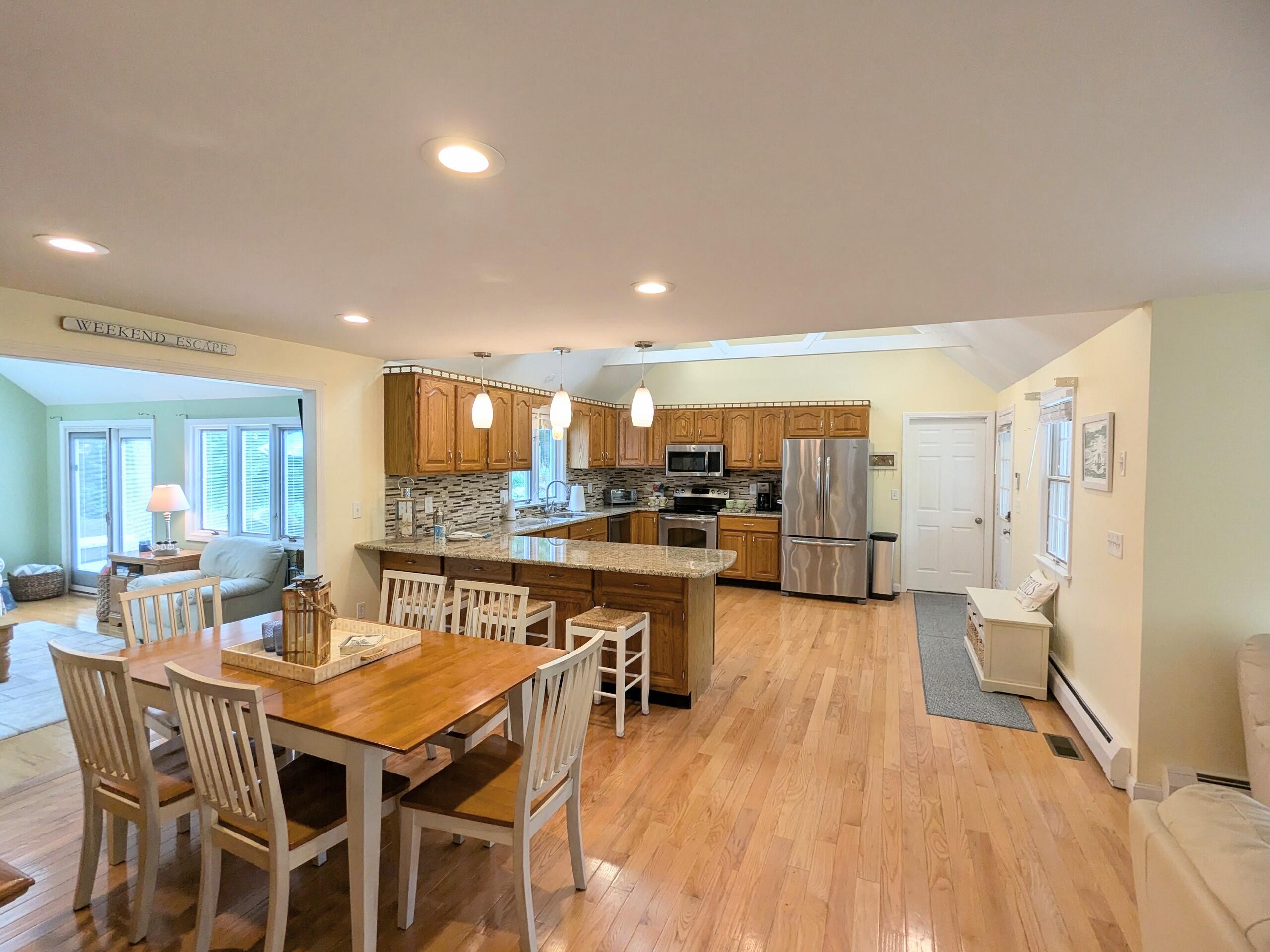 32 Apple Lane Dennis, MA 02638 - Photo 7 of 48 a dining hall with stainless steel appliances a dining table chairs and couches
