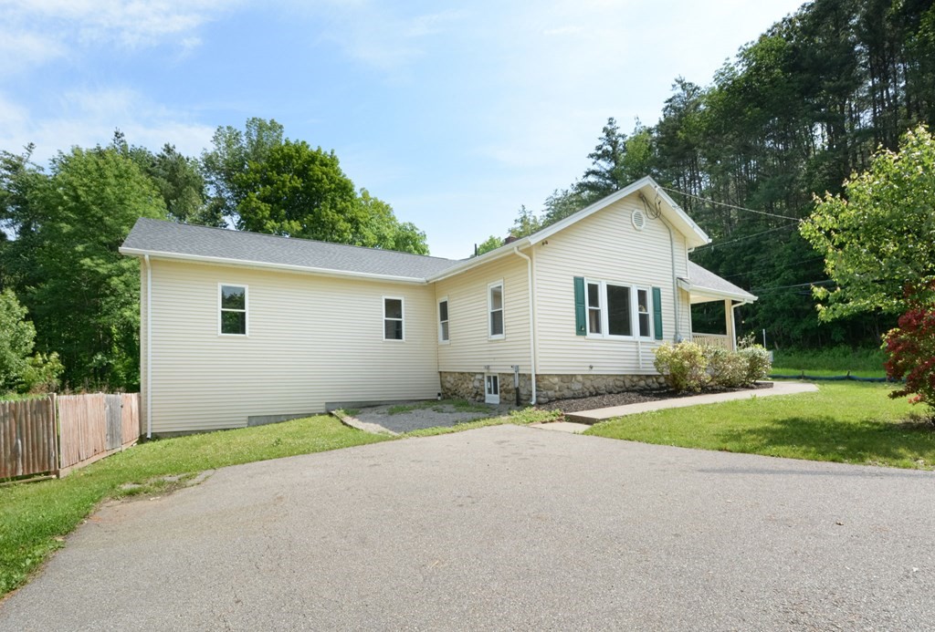 230 Southbridge Road Charlton, MA 01507 - Photo 11 of 35 a view of a house with yard and a garden