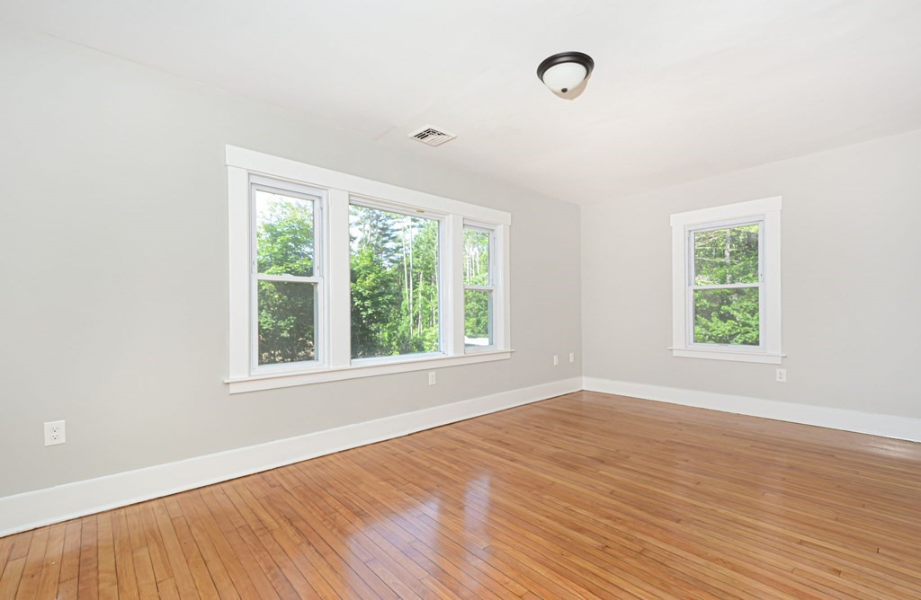 230 Southbridge Road Charlton, MA 01507 - Photo 14 of 35 an empty room with wooden floor and windows