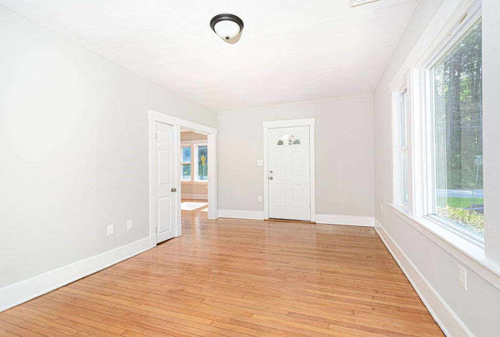 230 Southbridge Road Charlton, MA 01507 - Photo 15 of 35 a view of an empty room with wooden floor and a window