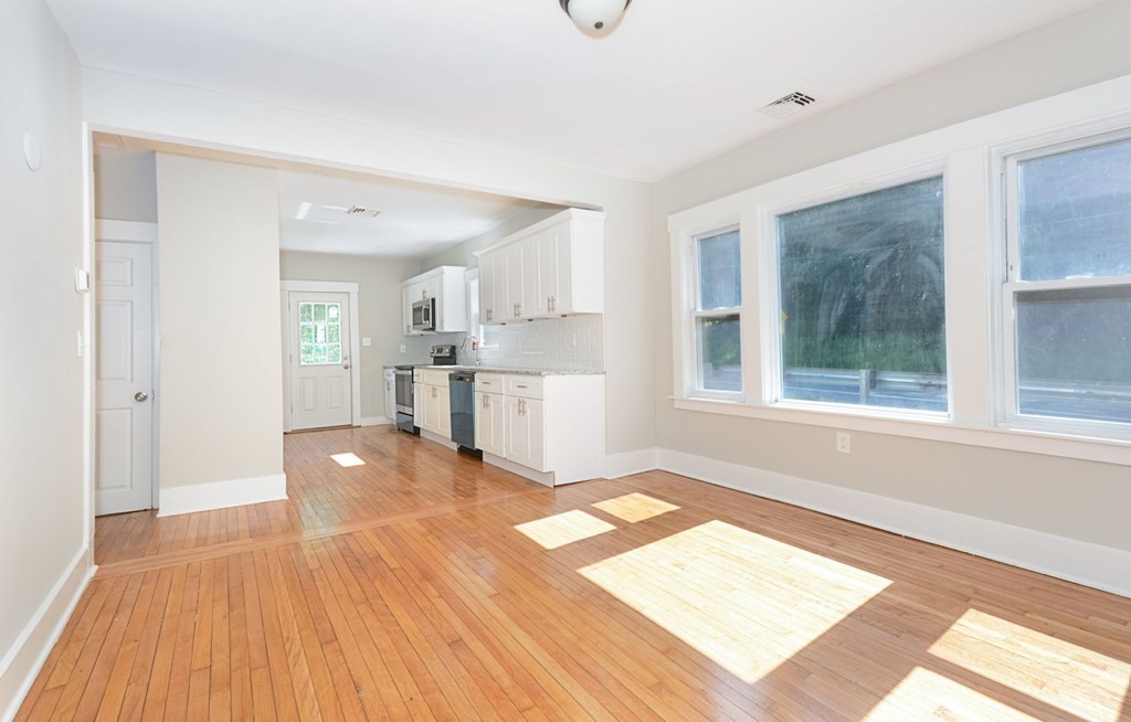 230 Southbridge Road Charlton, MA 01507 - Photo 16 of 35 a view of a kitchen with a fridge wooden floor and a window